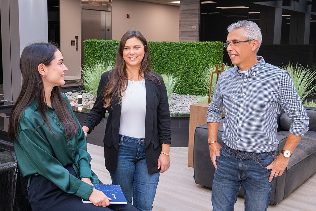 Paradigm team members having a discussion on ada website compliance for brands