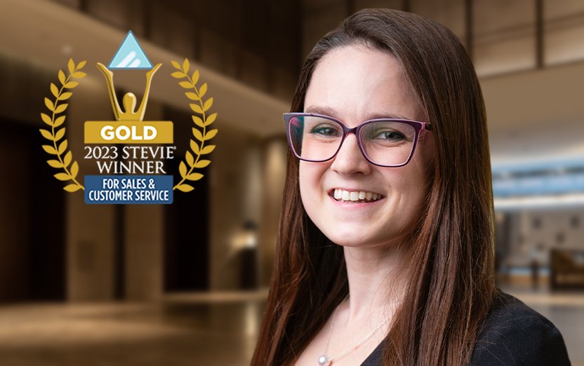 Logo of Gold Stevie Winner for Sales and Customer service on a picture of Kaitlyn