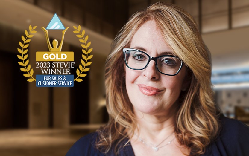 Logo of Gold Stevie Winner for Sales and Customer service on a picture of Vickie