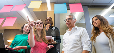 Male bookkeeper in blue shirt on computer
