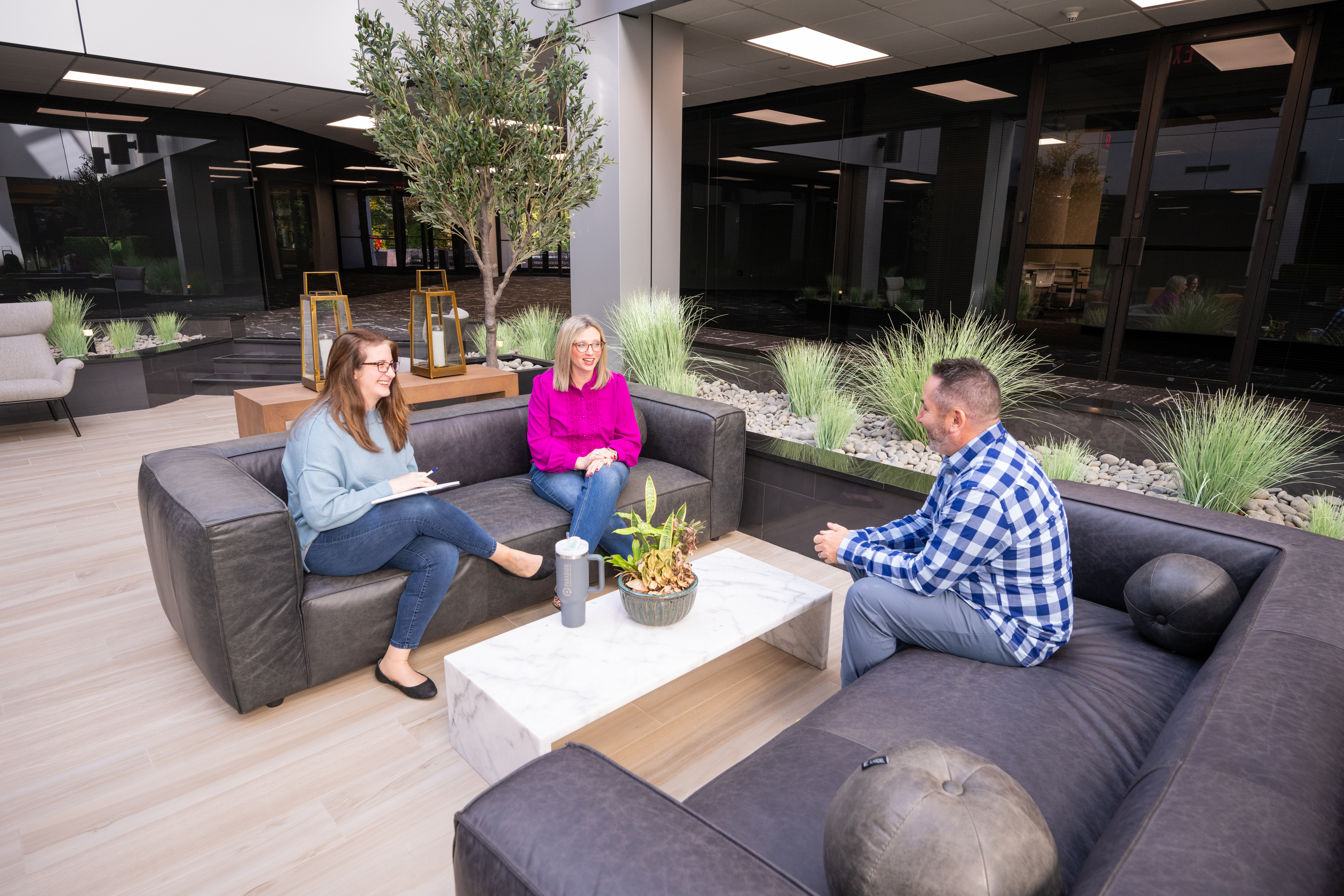Male bookkeeper in blue shirt on computer