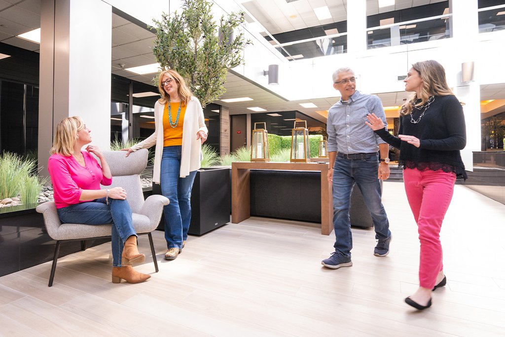 Marketing professional walking and discussing lead scoring best practices