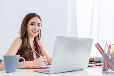 Female marketing assistant taking notes