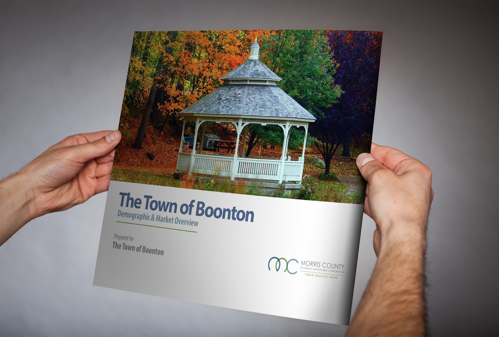 mcedc-8 Man holding brochure for Morris County Economic Development Committee