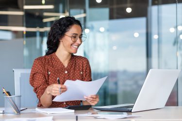 female account manager having virtual meeting on computer