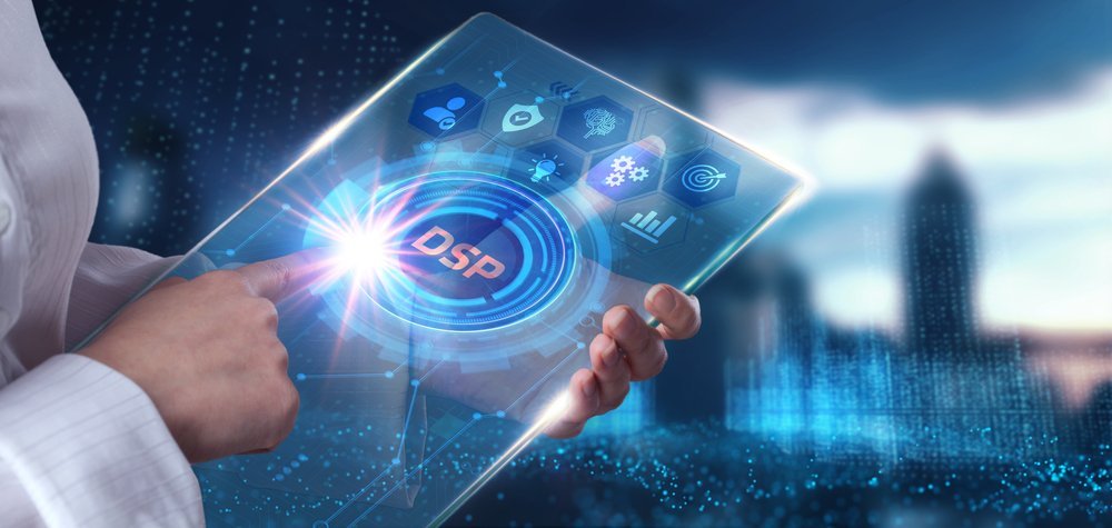 Finger pointing to DSP on a tablet concept with business, technology, internet and network icons